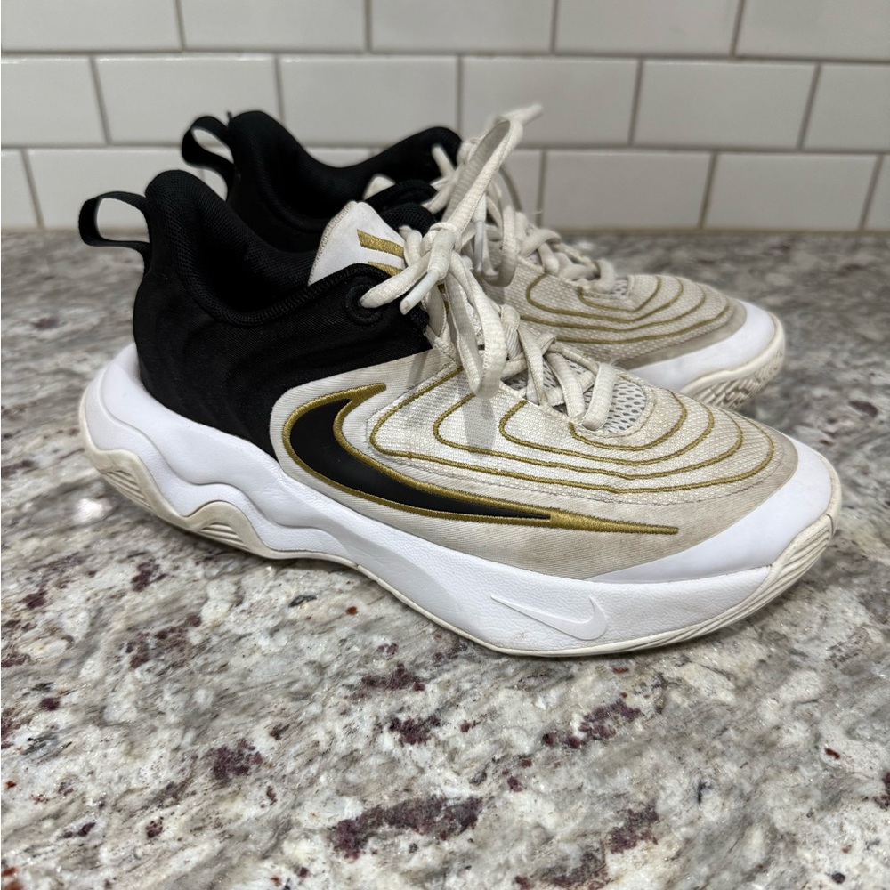 Nike Black and White Sneakers with Gold Highlights